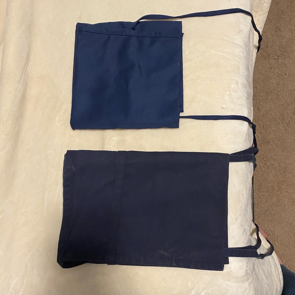 Two types of navy blue server aprons